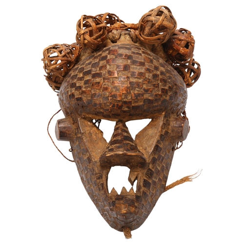 54 - A wood carved tribal mask with basket weave and copper detail,  probably Salampasu, Congo, length ap... 