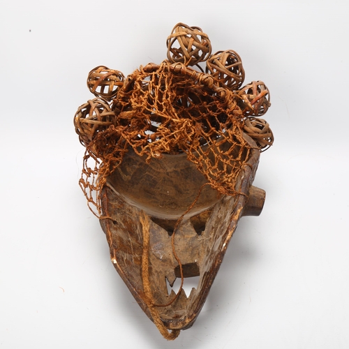 54 - A wood carved tribal mask with basket weave and copper detail,  probably Salampasu, Congo, length ap... 