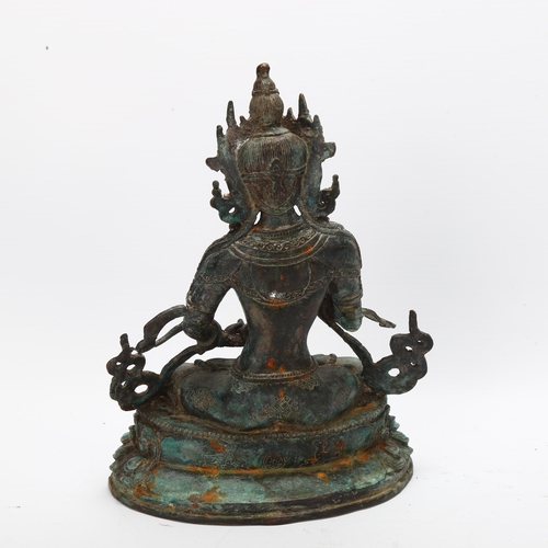 55 - A verdigris patinated metal Buddah, height 21cm