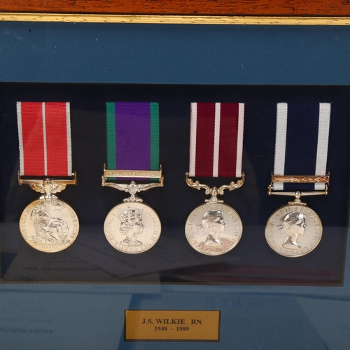 6 - *WITHDRAWN* A group of 4 Royal Navy Service medals, awarded to J S Wilkie (1948 - 1989), including a... 