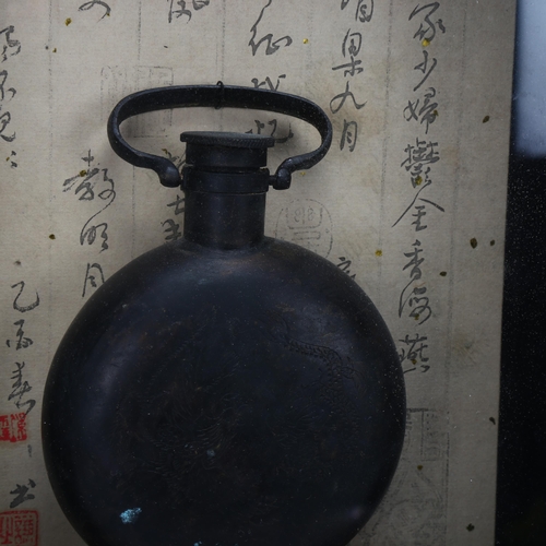 60 - A Chinese engraved patinated brass flask, mounted in lacquered glazed wall-hanging cabinet, height 5... 