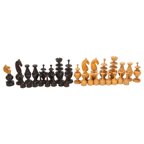 69 - An 18/19th century French Regence pattern chess set, turned boxwood and ebony pieces, king 73mm high