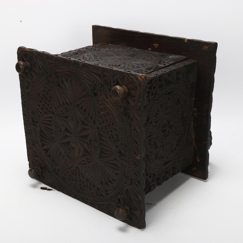 7 - 18th century oak carriage foot-warming stool, chip carved decoration allover with iron swing handle,... 