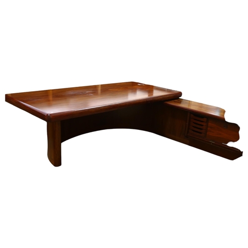 77 - Dyrlund, Denmark, a 1980s' Super Skyline santos-rosewood executive desk, with 3 inset drawers, on cu... 