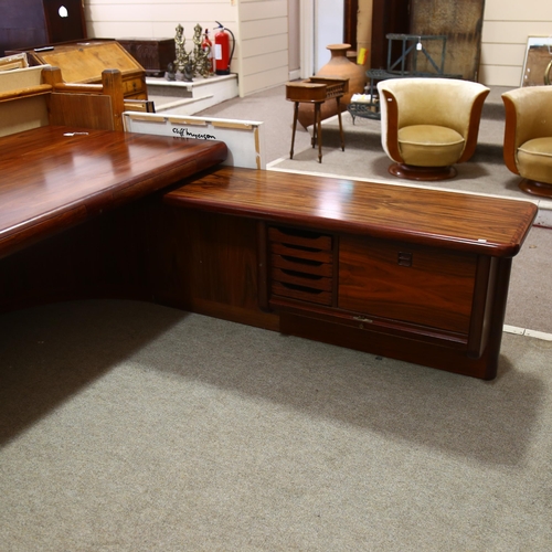 77 - Dyrlund, Denmark, a 1980s' Super Skyline santos-rosewood executive desk, with 3 inset drawers, on cu... 