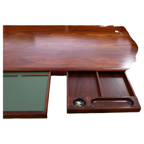 77 - Dyrlund, Denmark, a 1980s' Super Skyline santos-rosewood executive desk, with 3 inset drawers, on cu... 