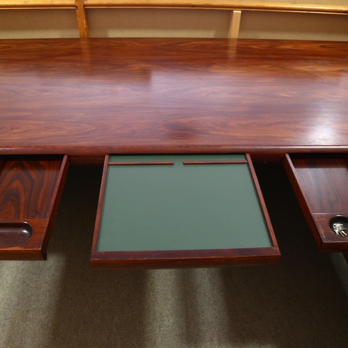 77 - Dyrlund, Denmark, a 1980s' Super Skyline santos-rosewood executive desk, with 3 inset drawers, on cu... 