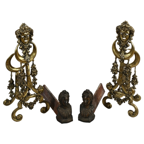 80 - A pair of cast-brass fireplace chenets with mask decorations, height 58cm, and a pair of bronze Clas... 