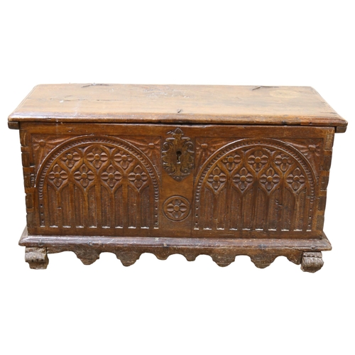 81 - An 18th century oak coffer of small size, of plank construction, with chip carved Arcadian front, 82... 