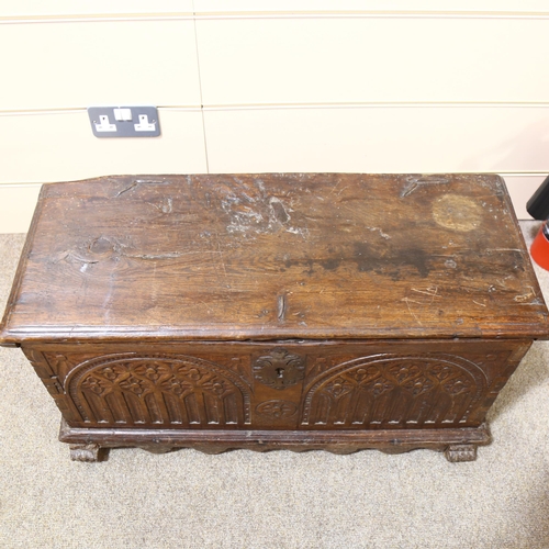 81 - An 18th century oak coffer of small size, of plank construction, with chip carved Arcadian front, 82... 