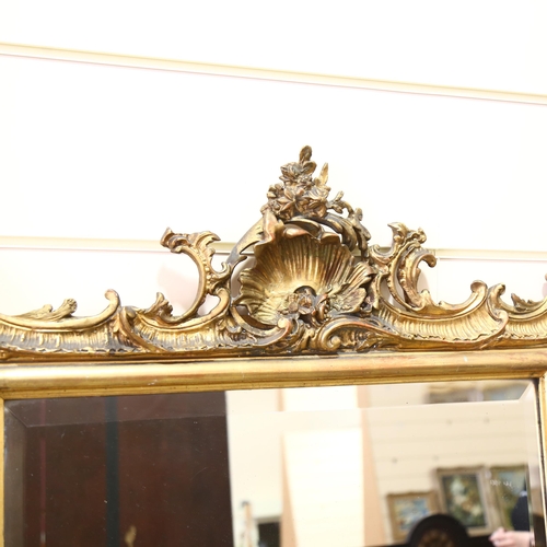 87 - A 19th century pier mirror with bevelled glass and Rococo style gilt frame, height 150cm, width 91cm