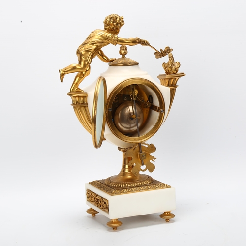 9 - A French alabaster and gilt-bronze mounted mantel clock, surmounted by a child holding a moth to a f... 