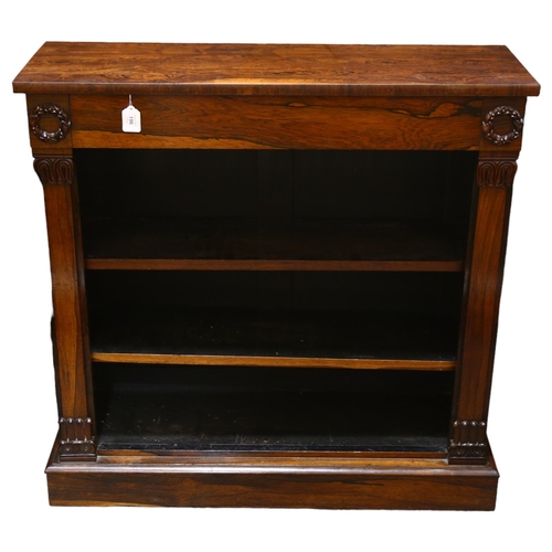 196 - A Regency rosewood open bookcase of small size, with carved laurel wreath bosses and acanthus carved... 