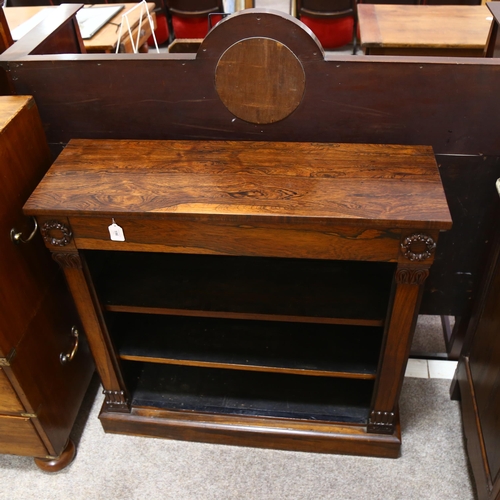 196 - A Regency rosewood open bookcase of small size, with carved laurel wreath bosses and acanthus carved... 