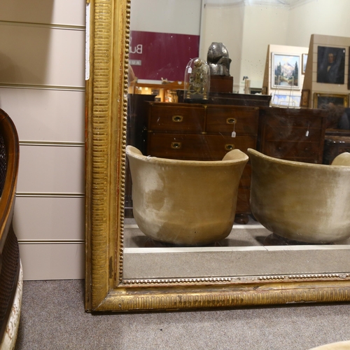 212 - An extremely large Louis Phillipe mirror, with gilt gesso cushion and beaded frame, 230 x180cm