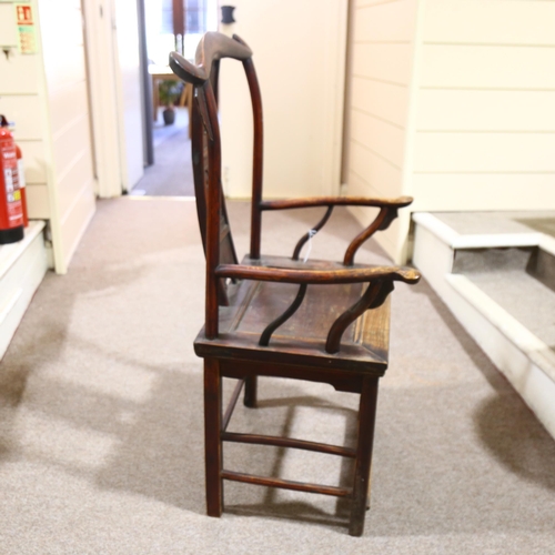 214 - An antique elm Chinese emperor's throne chair, with carved and pierced decoration. Overall 68x118x52... 