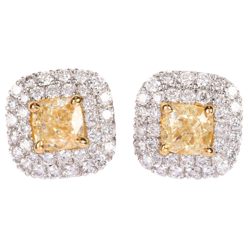 1260 - A pair of fancy yellow diamond and diamond halo cluster earrings, 18ct white gold stud fittings with... 