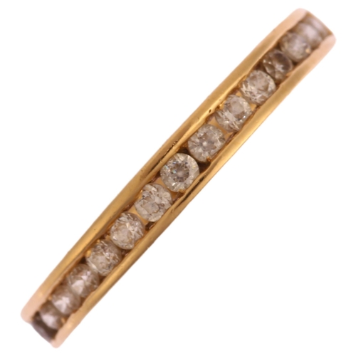 1262 - A 14ct gold cubic zirconia half eternity ring, channel set with modern round brilliant-cut cubic zir... 