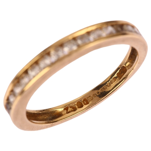 1262 - A 14ct gold cubic zirconia half eternity ring, channel set with modern round brilliant-cut cubic zir... 