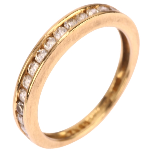 1262 - A 14ct gold cubic zirconia half eternity ring, channel set with modern round brilliant-cut cubic zir... 