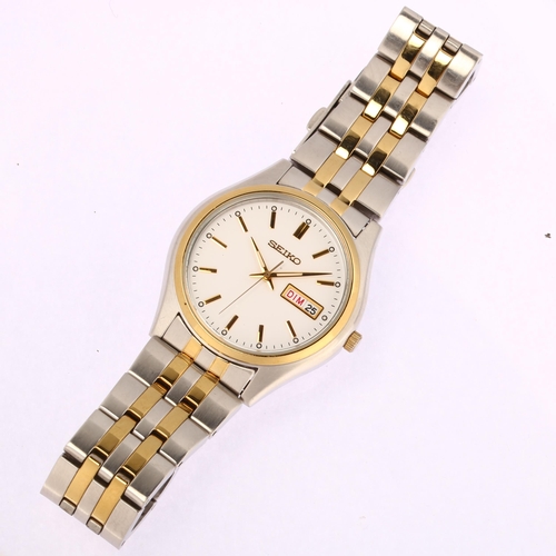 1015 - SEIKO - a gold plated stainless steel Day/Date quartz bracelet watch, ref. 7N43-0BF0, white dial wit... 