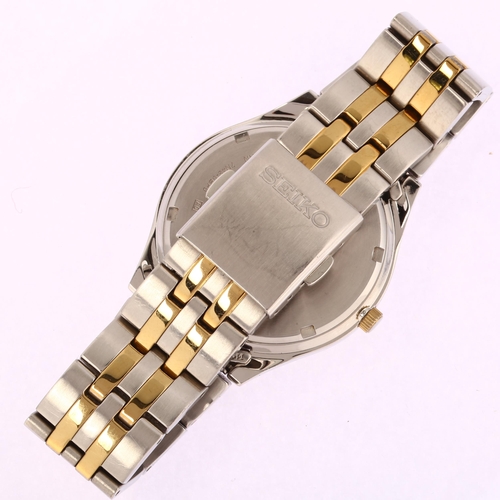 1015 - SEIKO - a gold plated stainless steel Day/Date quartz bracelet watch, ref. 7N43-0BF0, white dial wit... 