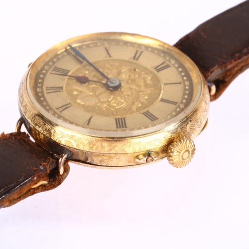 1017 - A Continental 14ct gold converted fob watch wristwatch, engraved floral dial with Roman numeral hour... 