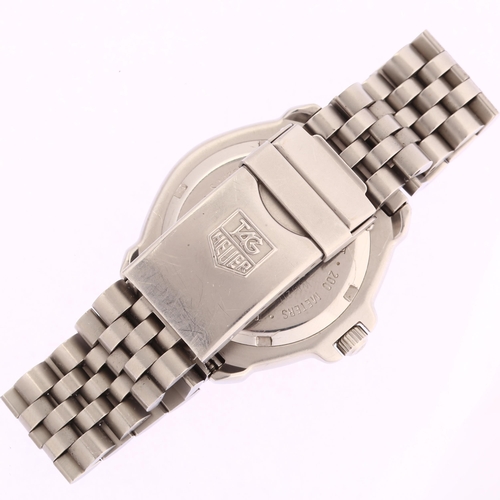 1021 - TAG HEUER - a mid-size stainless steel Formula 1 quartz bracelet watch, ref. WA1211, luminous dial w... 