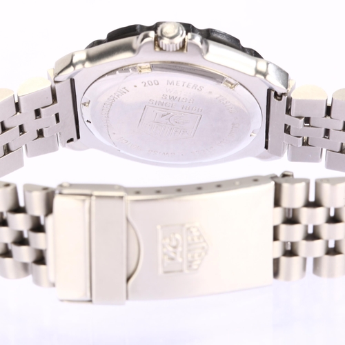 1021 - TAG HEUER - a mid-size stainless steel Formula 1 quartz bracelet watch, ref. WA1211, luminous dial w... 