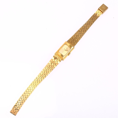 1028 - OMEGA - a lady's gold plated stainless steel De Ville mechanical bracelet watch, ref. 511.0459, circ... 