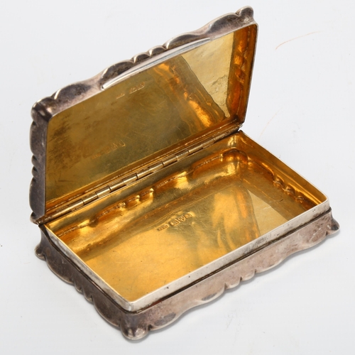 1405 - An Edwardian rectangular silver snuffbox, with concave side and scalloped edges, Stokes & Ireland Lt... 