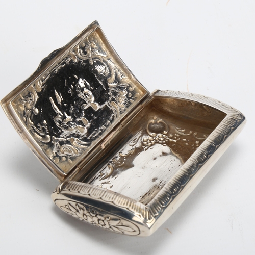 1406 - A Continental silver snuffbox, with hinged lid and relief design of rural figures to the lid, marks ... 