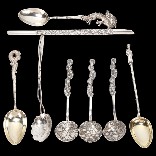 1413 - A Chinese silver dip pen, and 7 Oriental silver spoons, mostly of dragon design