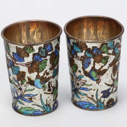 1414 - A pair of small Chinese silver and enamel drinking tots, with bird and blossom designs, impressed ma... 