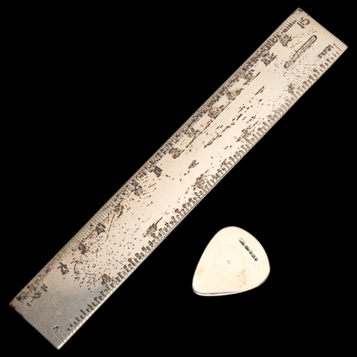 1428 - A modern silver ruler, length 16cm, and a modern silver guitar pick