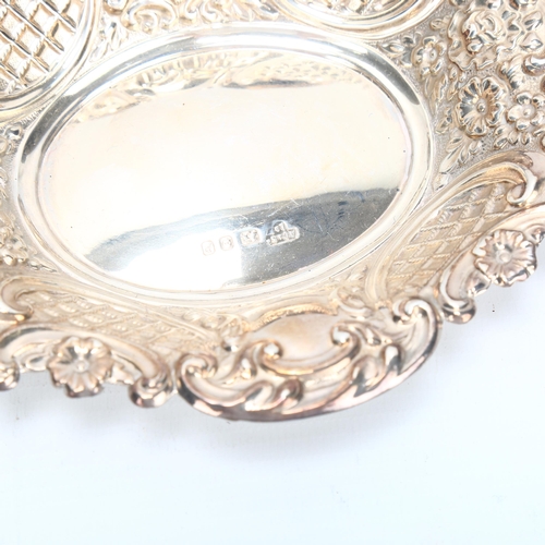 1443 - Elizabeth II oval silver bon bon dish with embossed decoration, London 1970, length 15.5cm, and a pa... 