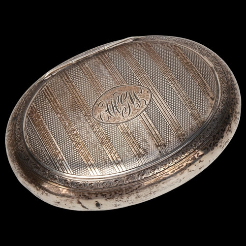 1447 - George V oval silver tobacco box, engine turned decoration, Chester 1924, 2.8oz, length 10cm