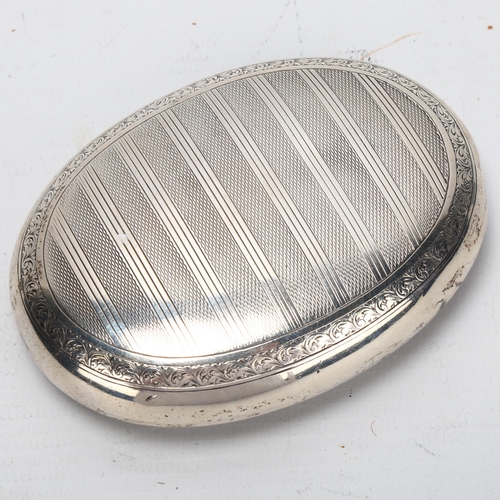 1447 - George V oval silver tobacco box, engine turned decoration, Chester 1924, 2.8oz, length 10cm