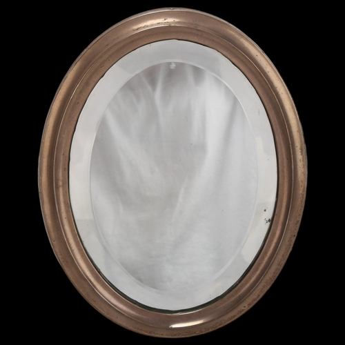 1449 - George V oval silver strut mirror, Birmingham 1926, with oak strut back, height 24.5cm