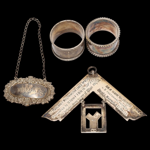 1455 - 2 silver napkin rings, a silver Whisky decanter label, and a silver Masonic jewel, 5.24oz gross