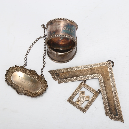 1455 - 2 silver napkin rings, a silver Whisky decanter label, and a silver Masonic jewel, 5.24oz gross