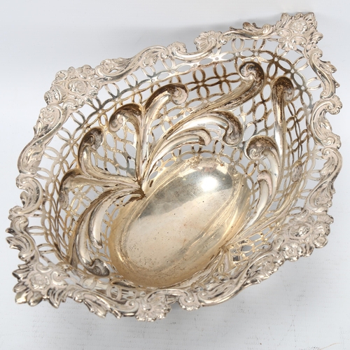 1467 - A Victorian silver table centre fruit bowl of oval form, floral embossed surround with shaped and pi... 