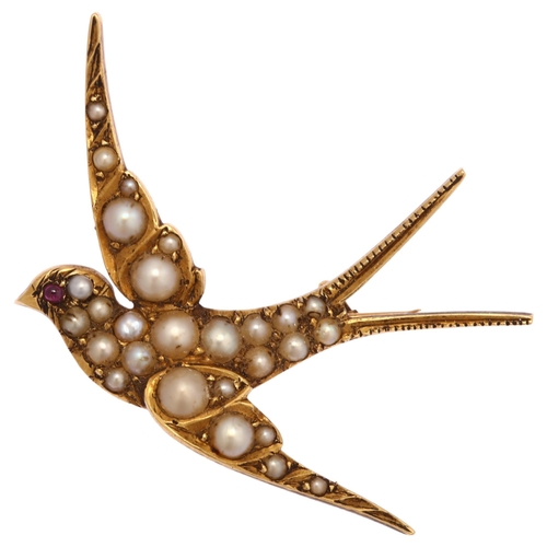 1103 - An Edwardian pearl and ruby swallow bird brooch, circa 1905, unmarked gold settings, wingspan 41.3mm... 