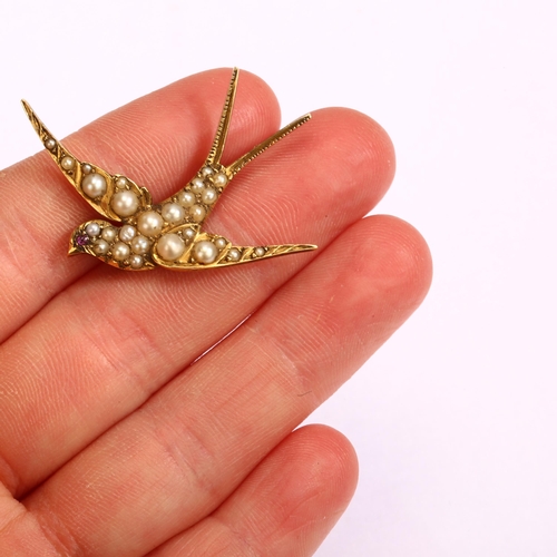 1103 - An Edwardian pearl and ruby swallow bird brooch, circa 1905, unmarked gold settings, wingspan 41.3mm... 