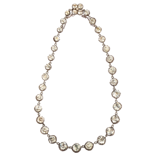 1106 - A Georgian silver and gold backed paste Riviere necklace, the foil-backed paste in cut-down collet s... 