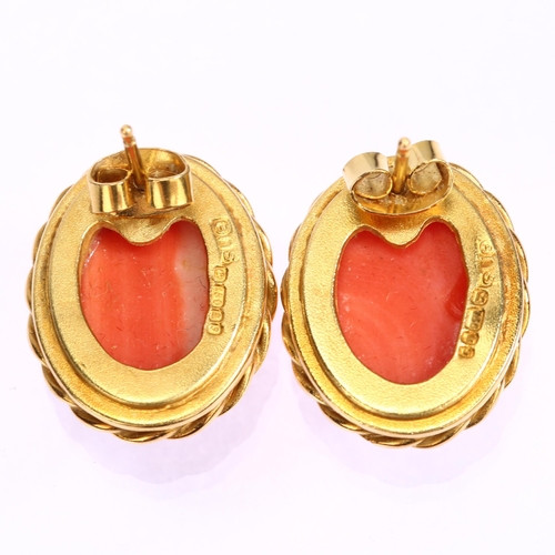 1110 - A pair of late 20th century 18ct gold coral earrings, maker's mark SUE, London 1980, set with rib-cu... 