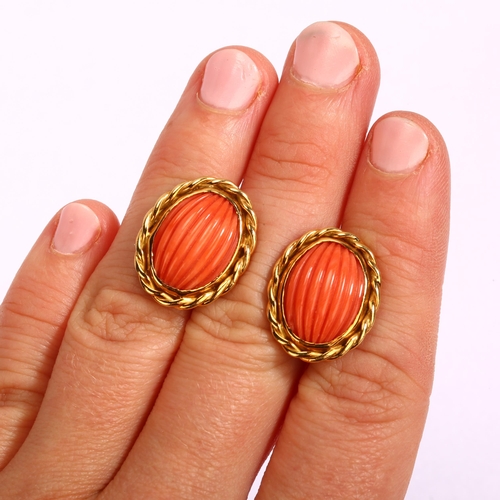 1110 - A pair of late 20th century 18ct gold coral earrings, maker's mark SUE, London 1980, set with rib-cu... 