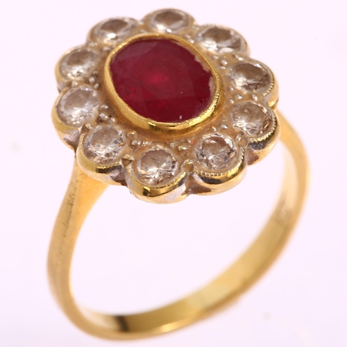 1116 - An 18ct gold ruby and diamond oval cluster ring, set with oval mixed-cut ruby and modern round brill... 