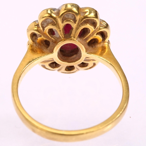 1116 - An 18ct gold ruby and diamond oval cluster ring, set with oval mixed-cut ruby and modern round brill... 