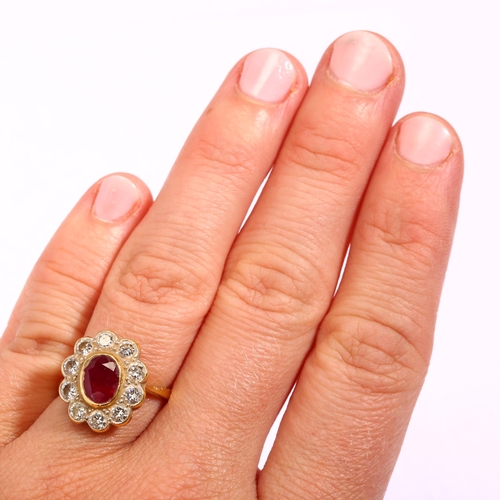 1116 - An 18ct gold ruby and diamond oval cluster ring, set with oval mixed-cut ruby and modern round brill... 